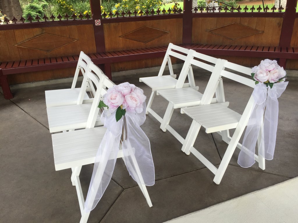 White wooden chairs Weddings Of Distinction